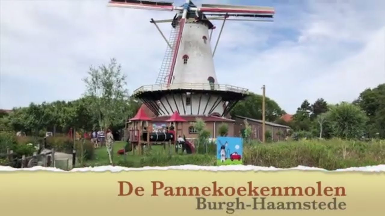Die Windmühle De Pannekoekenmolen in Burgh-Haamstede mit Spielplatz und grüner Umgebung.